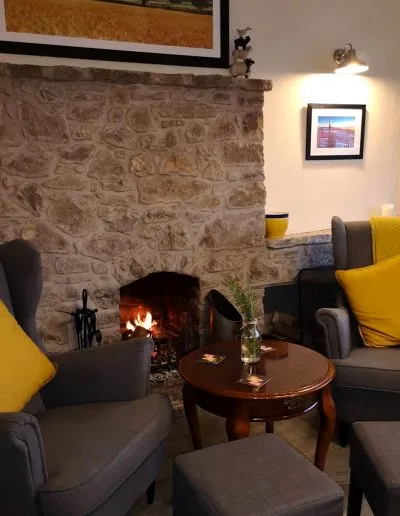 Relax next to the fire at the Nant y Felin